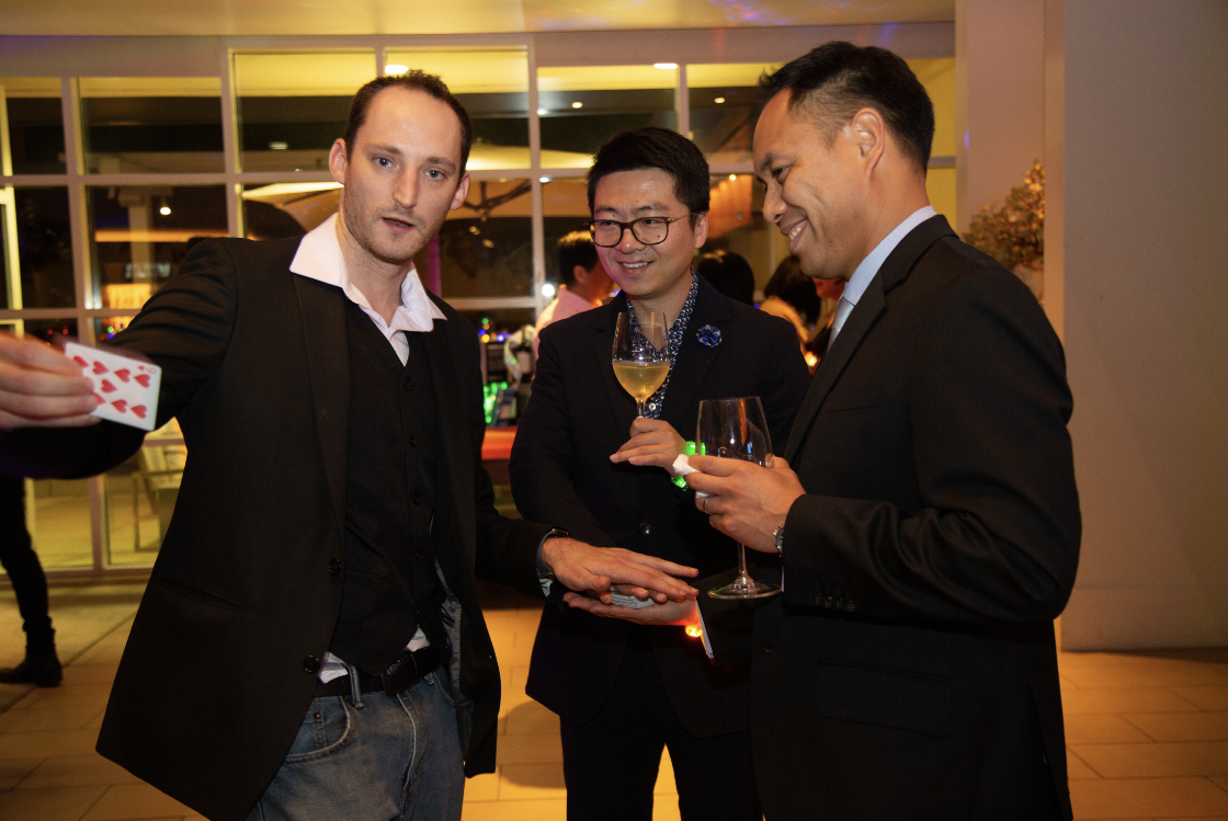 Close-up card magic at cocktail event